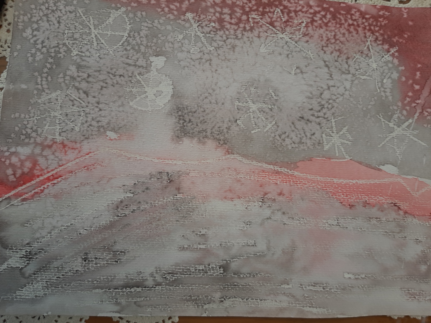 This is Keegan's winter scene on water colour paper with water colours, white crayon and salt.